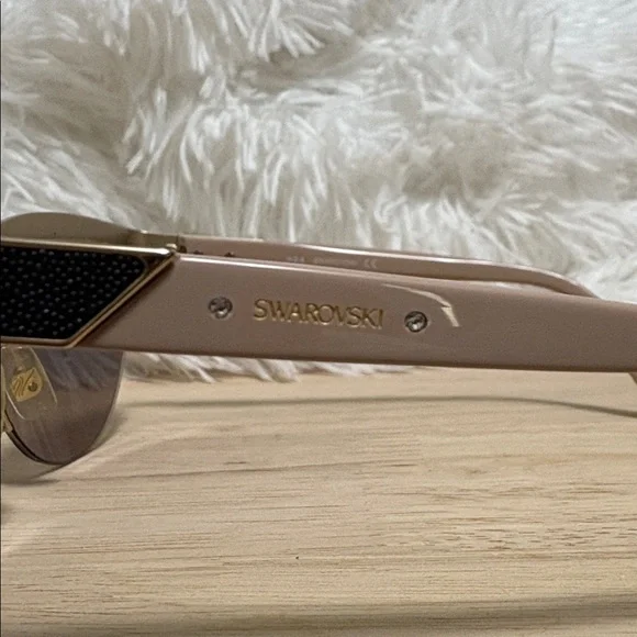 SWAROVSKI: Elegant Black and Gold Sunglasses